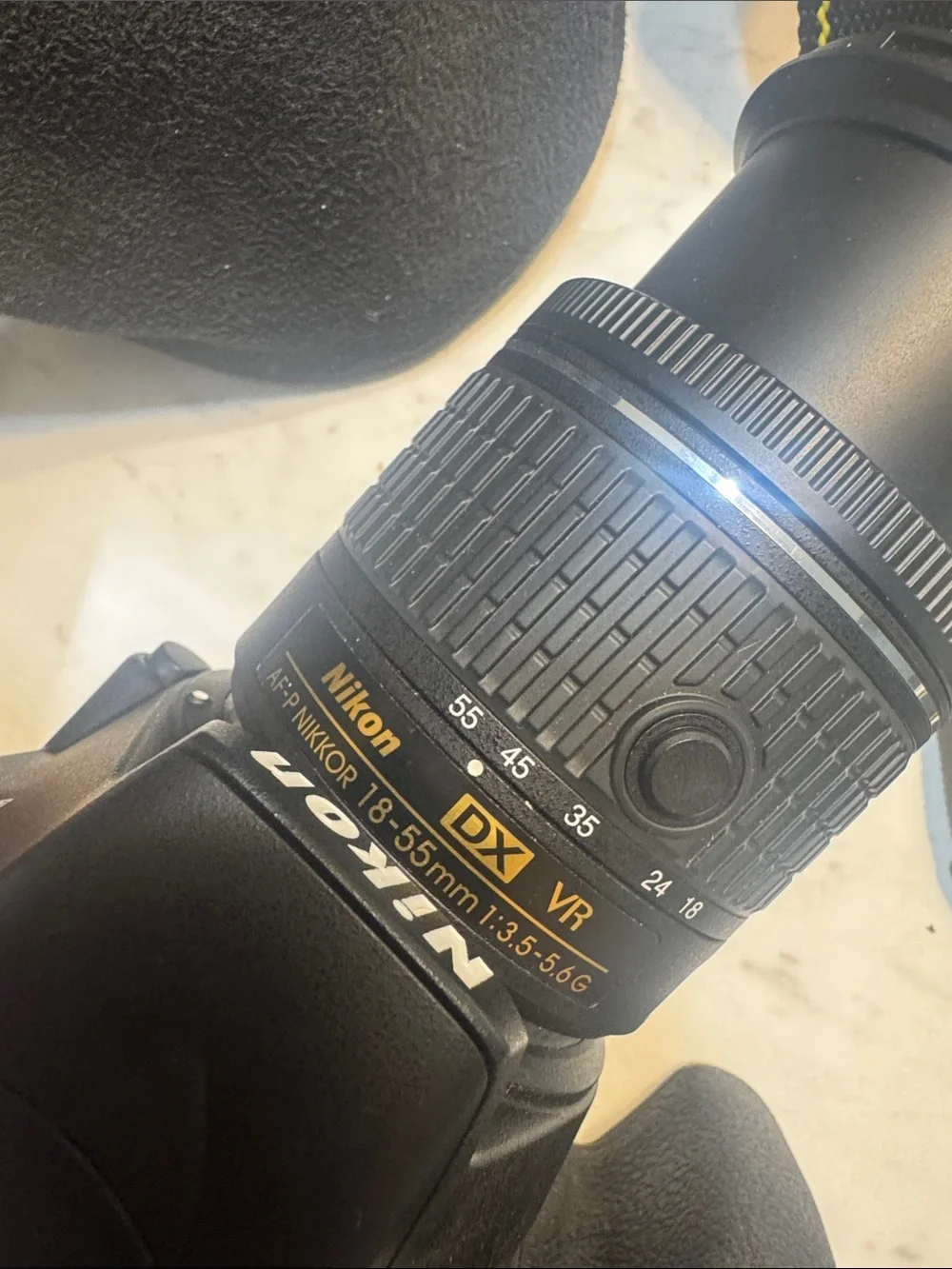 Nikon Black DSLR with Black Lenses and Yellow-Trim Strap